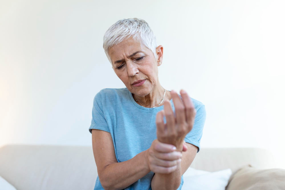 old woman concerned about bone weakning